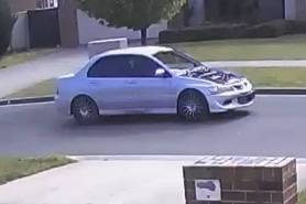 a CCTV still image of a silver car with a damaged bonnet