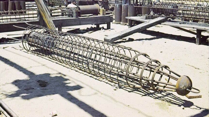 Gambia piles like giant tent pegs in the fabrication yard c1958