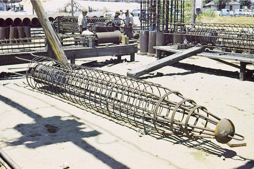 Gambia piles like giant tent pegs in the fabrication yard c1958