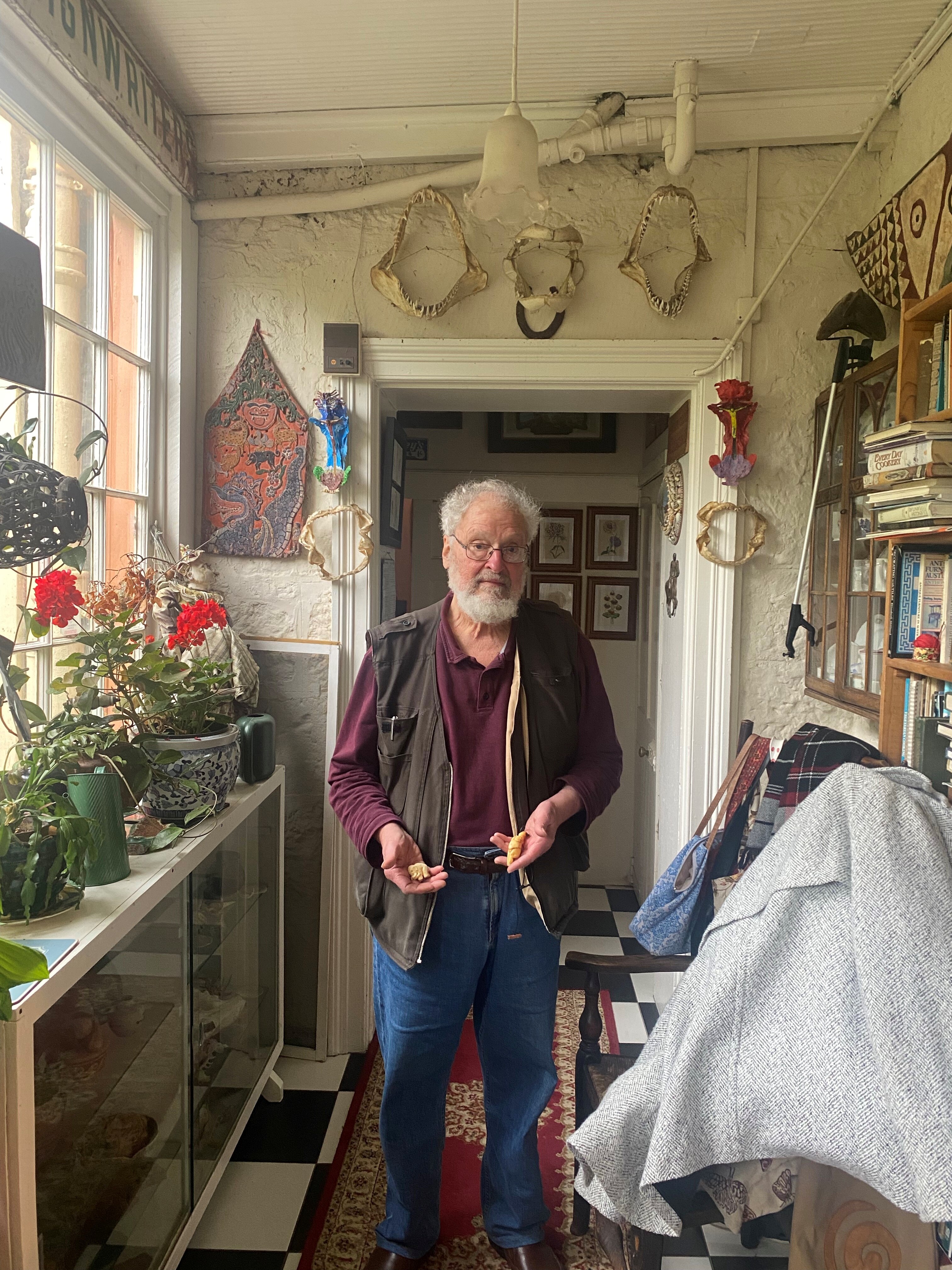 Kim Akerman holding carvings