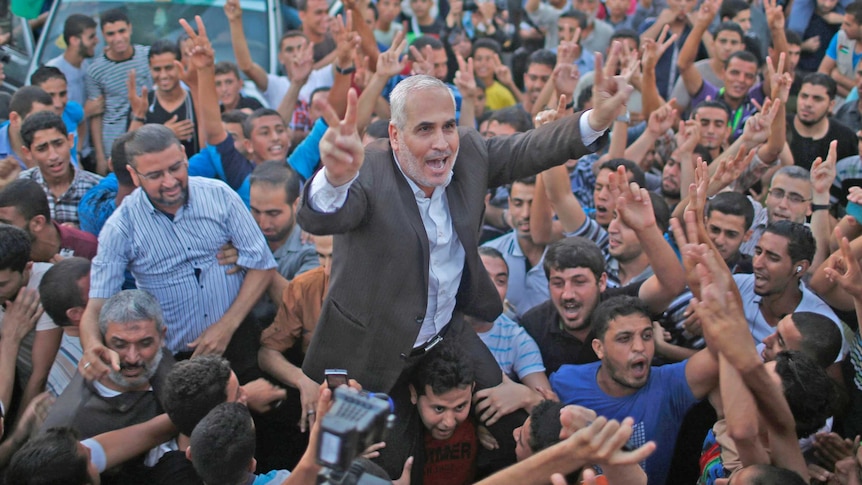 Palestinians celebrate after ceasefire declared