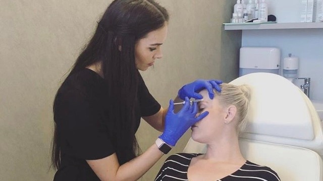 Woman receiving cosmetic injections