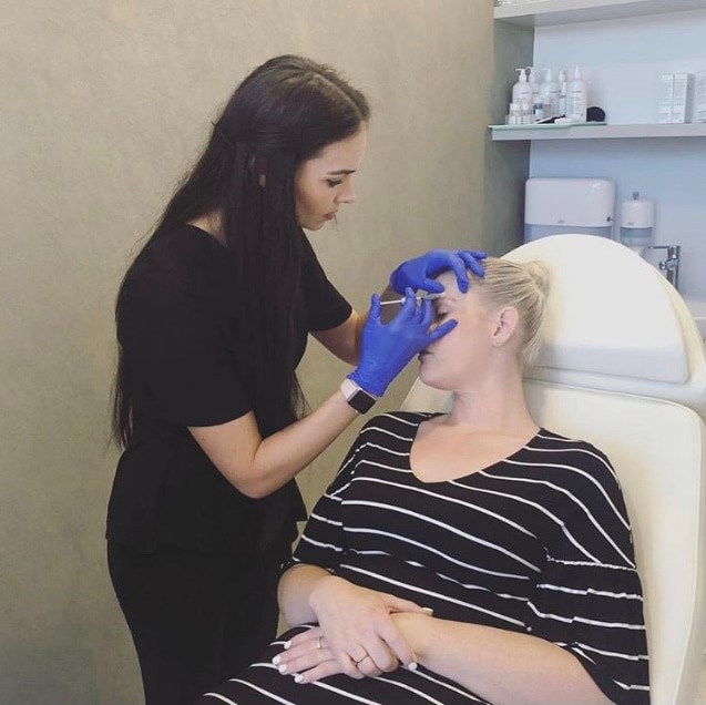 Woman receiving cosmetic injections