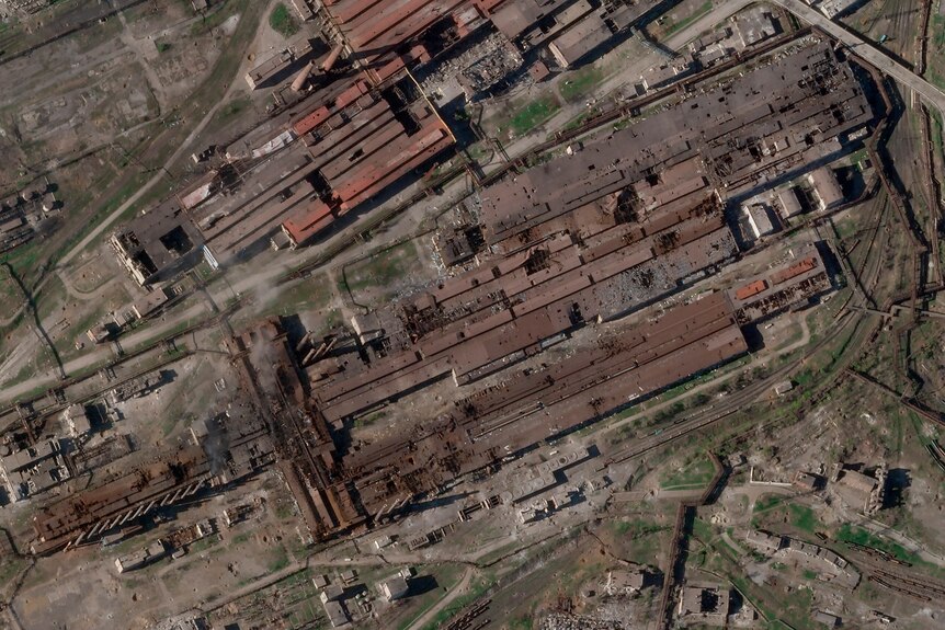 Satellite image shows damage to Azovstal steel plant, including large holes in roofs