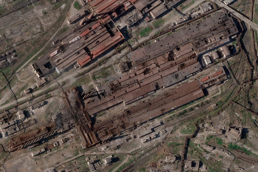 A satellite image shows damage at the Azovstal steelworks including large holes in roofs