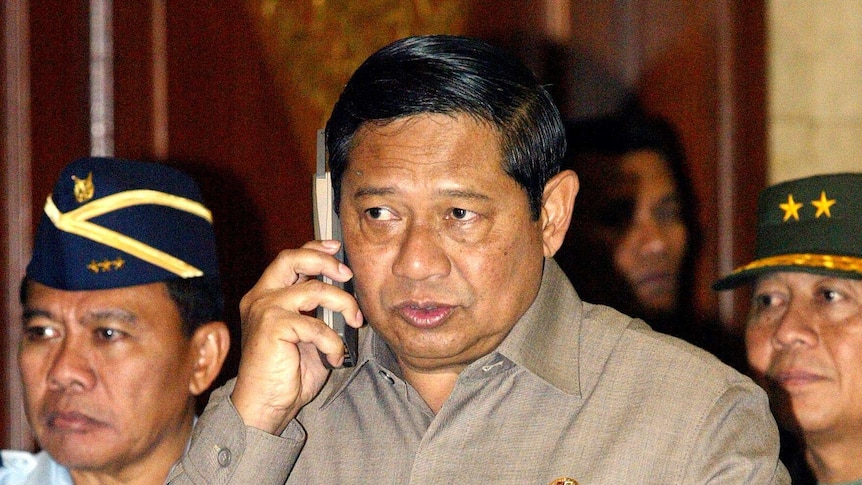 Susilo Bambang Yudhoyono speaks on his mobile phone