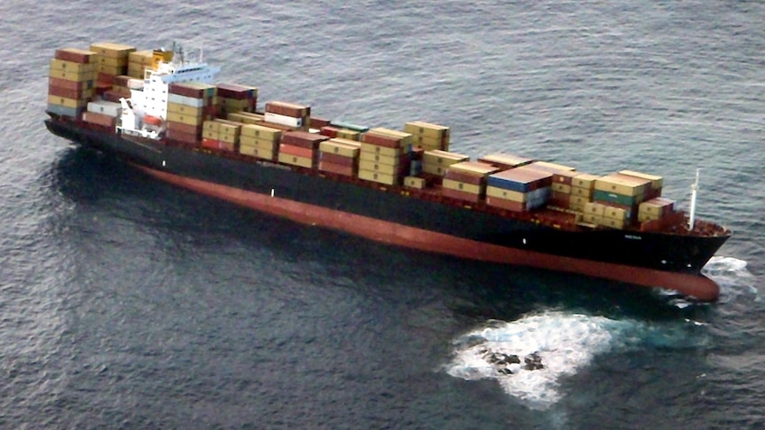 The Liberian-flagged 47,000 tonne container vessel Rena sits atop the Astrolabe Reef