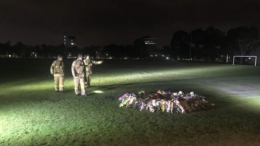 Firefighters at the scene of a memorial for killed Melbourne comedian Eurydice Dixon.
