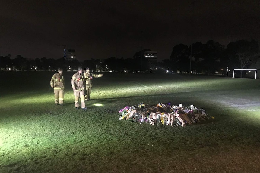 Firefighters at the scene of a memorial for killed Melbourne comedian Eurydice Dixon.