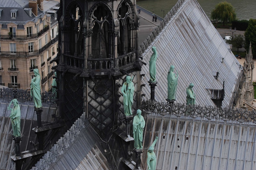 The apostle statues on top of the roof, descending down from the spire
