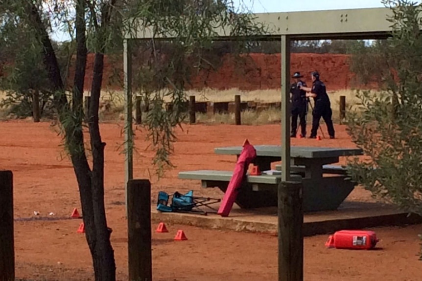 Police at a crime scene at Connors Well roadside stop in the NT