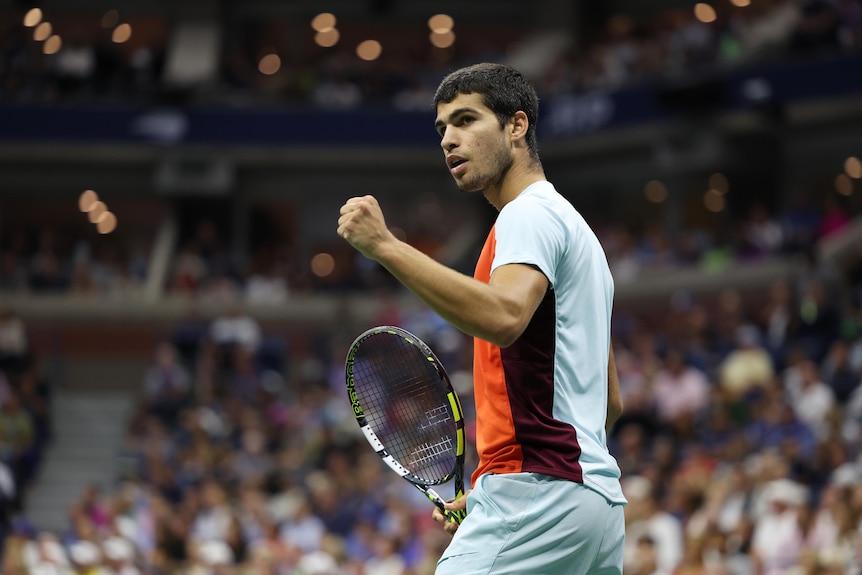 Spain's Carlos Alcaraz pumps his fist after winning a point as he turns to his box during a final.