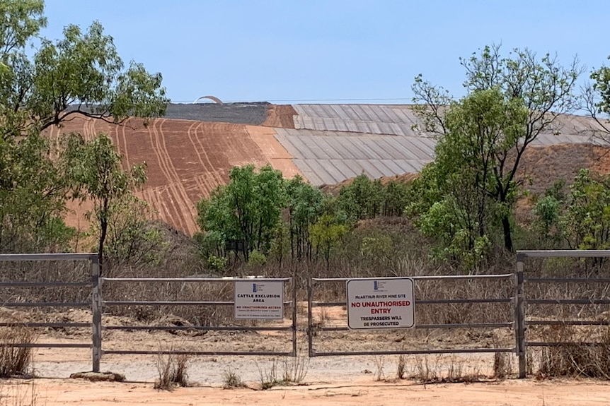 A mine waste rock dump with coverings on it