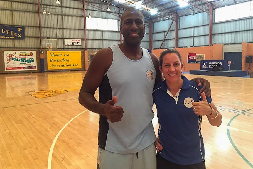 Basketballers Andre Moore and Micaela Cocks in Mount Isa