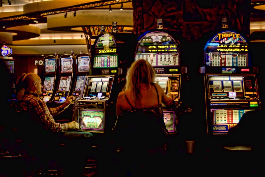People playing pokie machines at the Cherokee Casino in Siloam Spring.