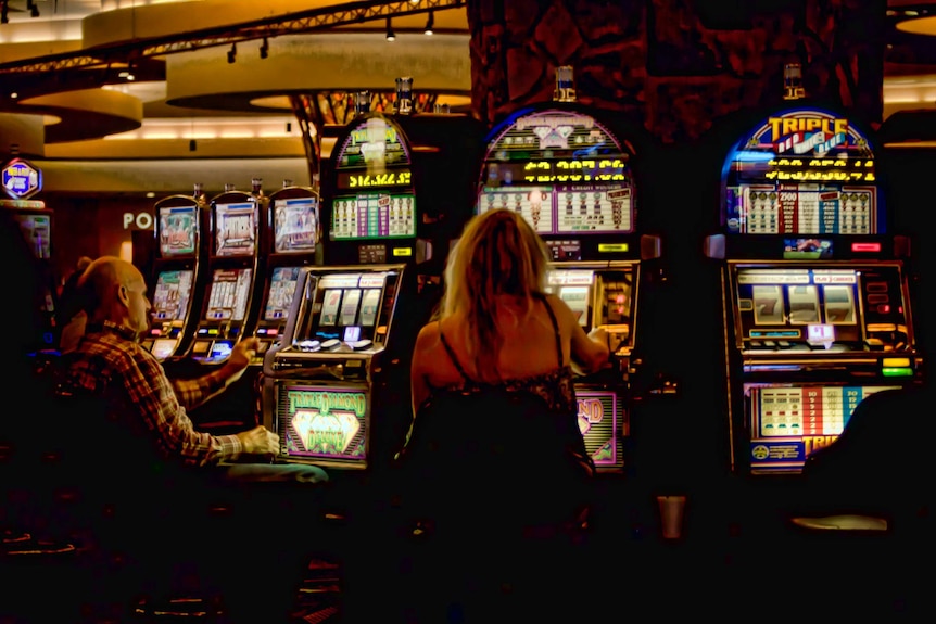 People playing pokie machines at the Cherokee Casino in Siloam Spring,