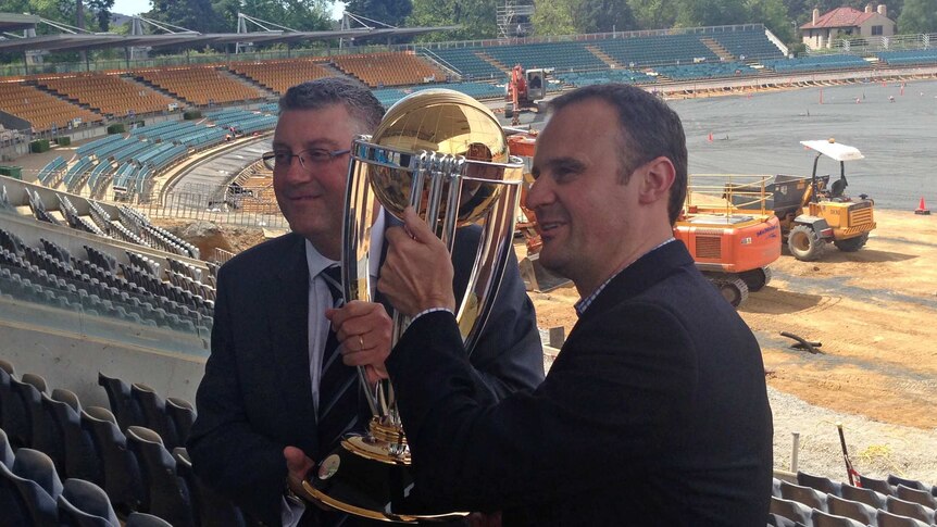 Cricket World Cup organising committee CEO John Harnden and Sports Minister Andrew Barr with the trophy.