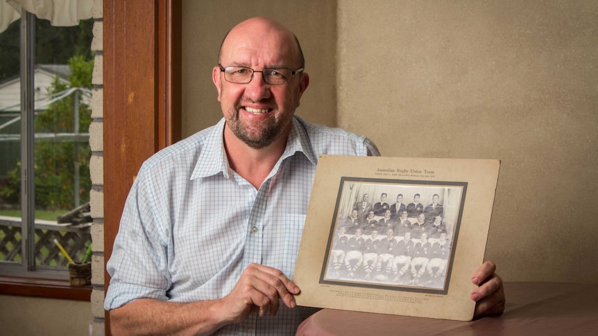 Ross Burke, the son of Wallabies great Cyril Burke, with one of his father's team photos.