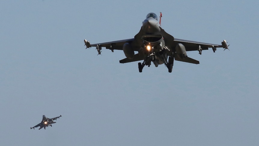 US Air Force F-16 fighter jets in the sky. 