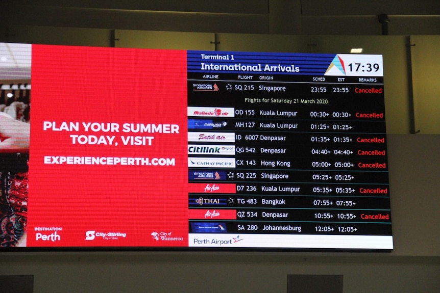 Flight arrival board at Perth Airport listing numerous cancelled flights.