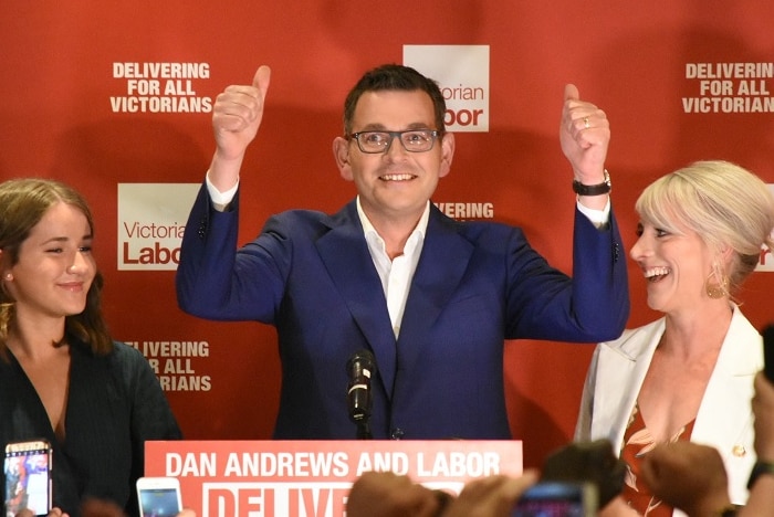 Daniel Andrews holds two thumbs up.