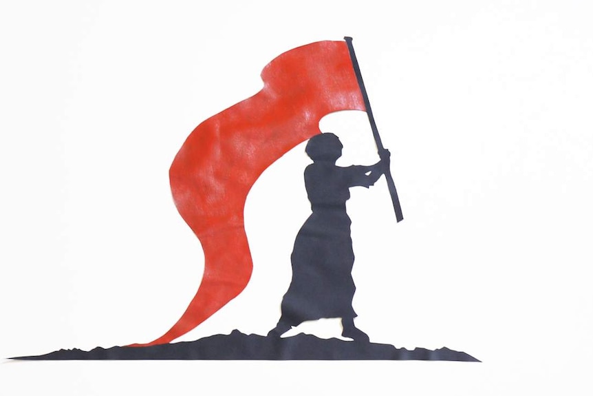 A silhouette of a woman holding a red flag.