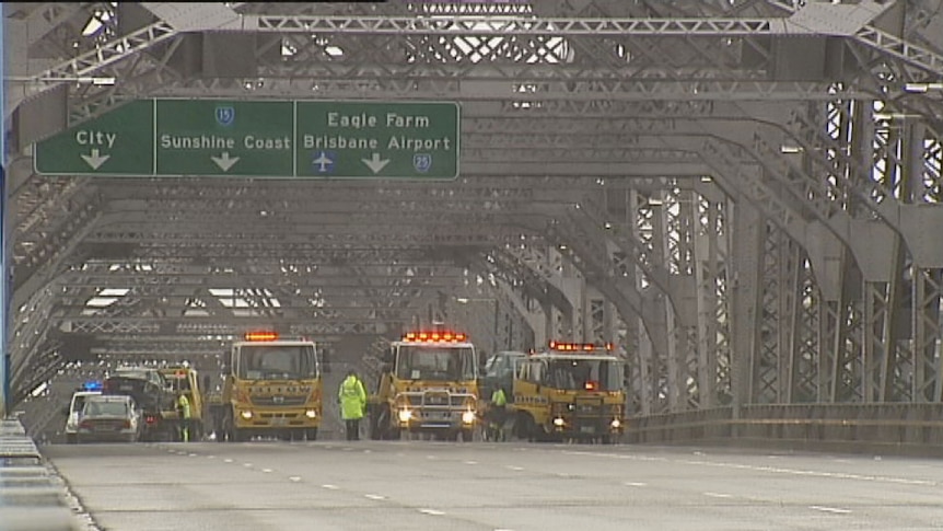 Authorities work to clear the Story Bridge after a four-car crash this morning