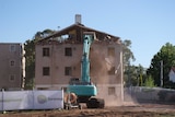 Dickson Towers being demolished.