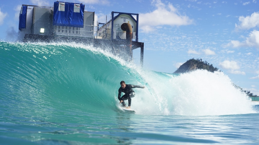 Dean Morrison rides a wave at the Surf Lakes complex near Rockhampton.