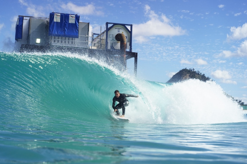 Dean Morrison rides a wave at the Surf Lakes complex near Rockhampton.