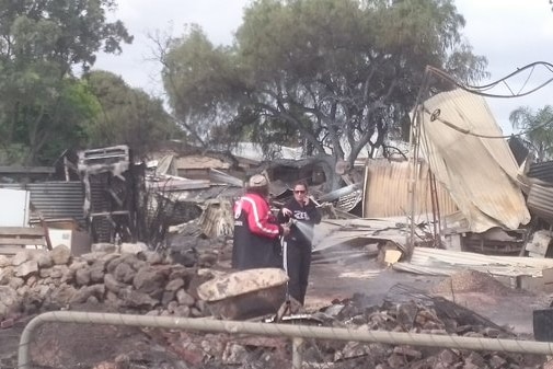 Terry Curtis assesses fire damage