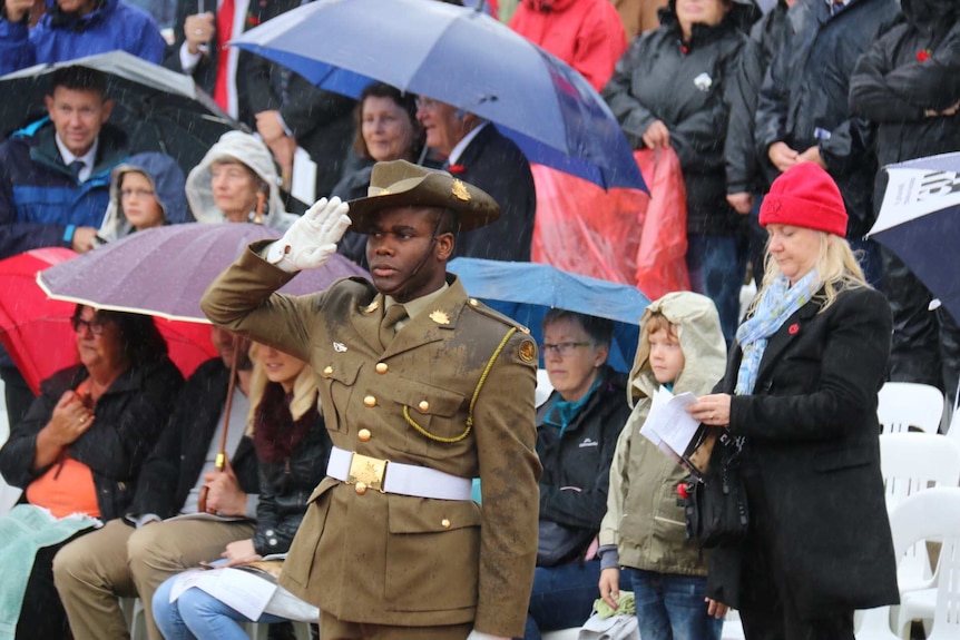 People participate in the Anzac Day national ceremony in Canberra.