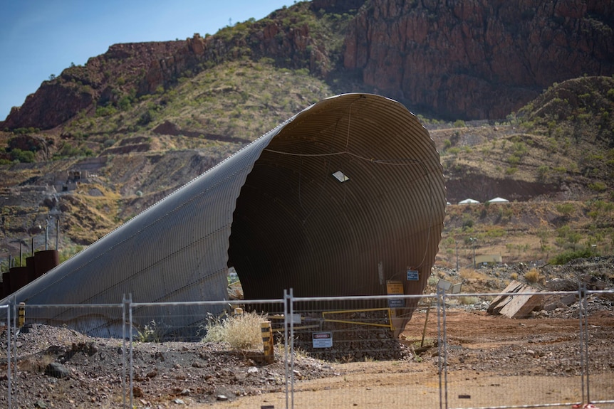 A large archway-type structure fenced off.