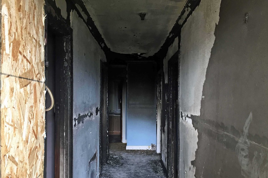 Inside a house damaged by arson in Hobart