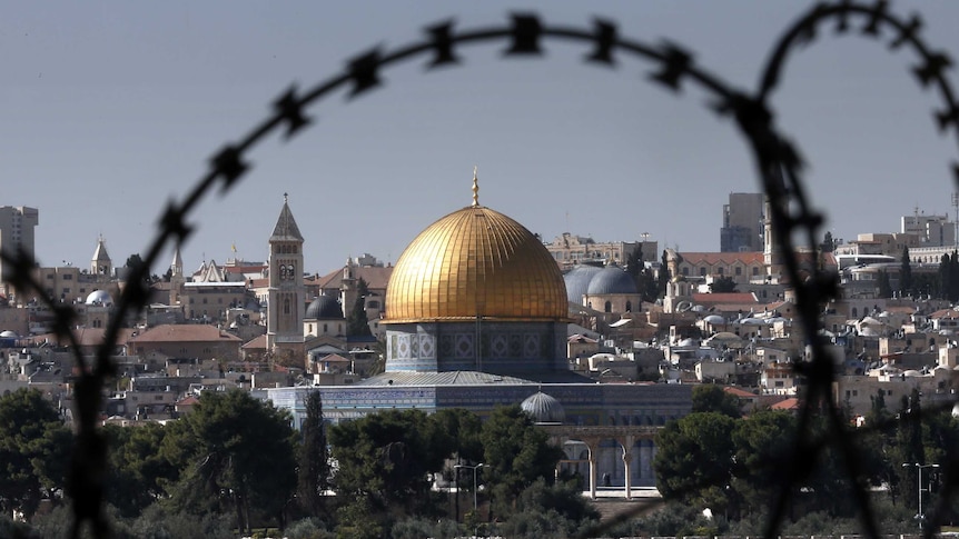The Dome of the Rock on Al Aqsa mosque seen through barbed wire