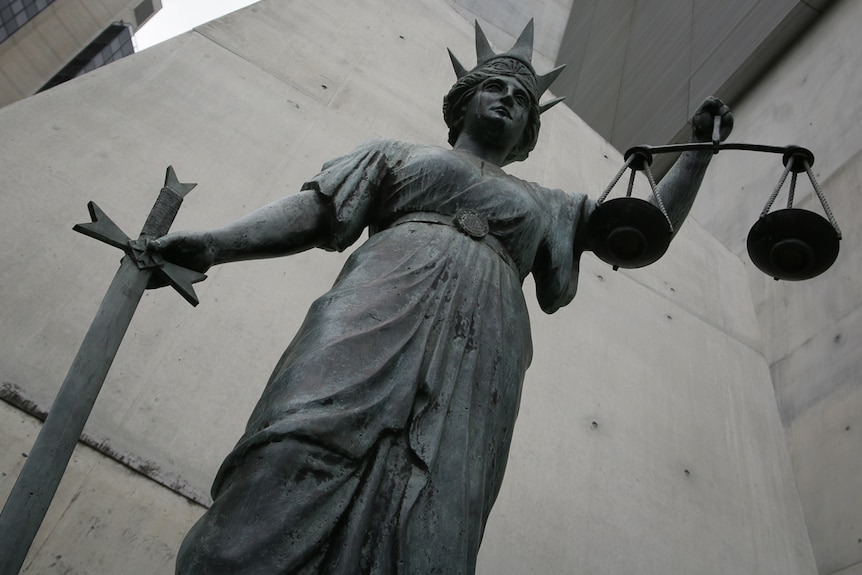 Lady of justice statue outside Brisbane's Supreme and District Courts building.