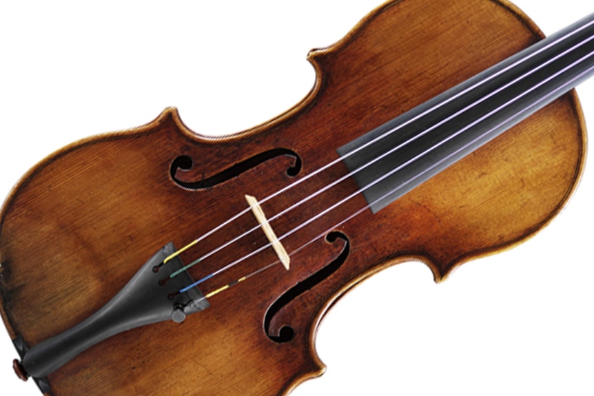 An image of the front of the 1728-29 Stradivarius violin, with old gold and brown varnish.