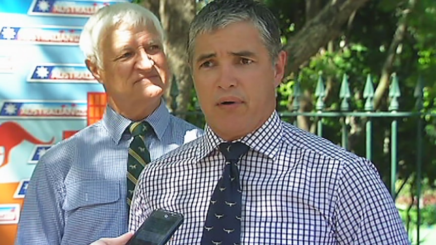 Robbie Katter (front) and father Bob Katter respond to the election announcement.