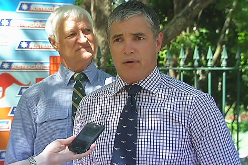 Robbie Katter (front) and father Bob Katter respond to the election announcement.