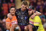 Tom Trbojevic is carried from the field by Sea Eagles trainers after being injured against the Broncos.