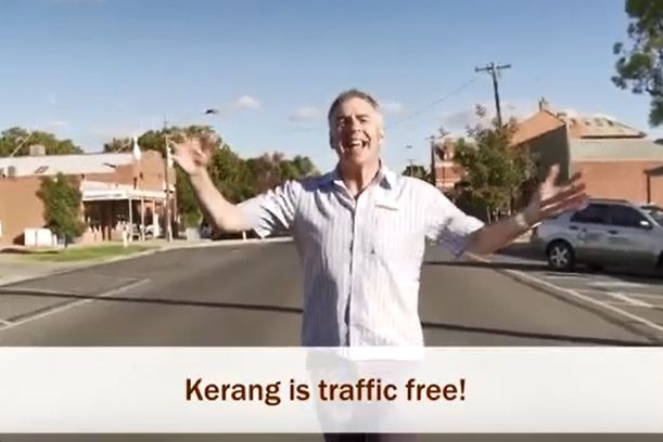 Man singing while standing on road