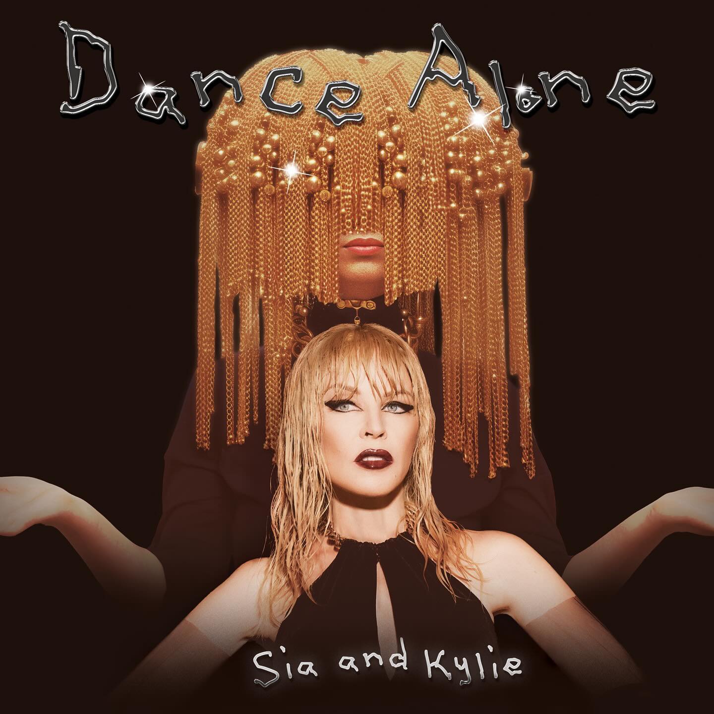 On a black background, Sia's face is obscured by draped pearls in the shape of her oversized wigs, with Kylie underneath.