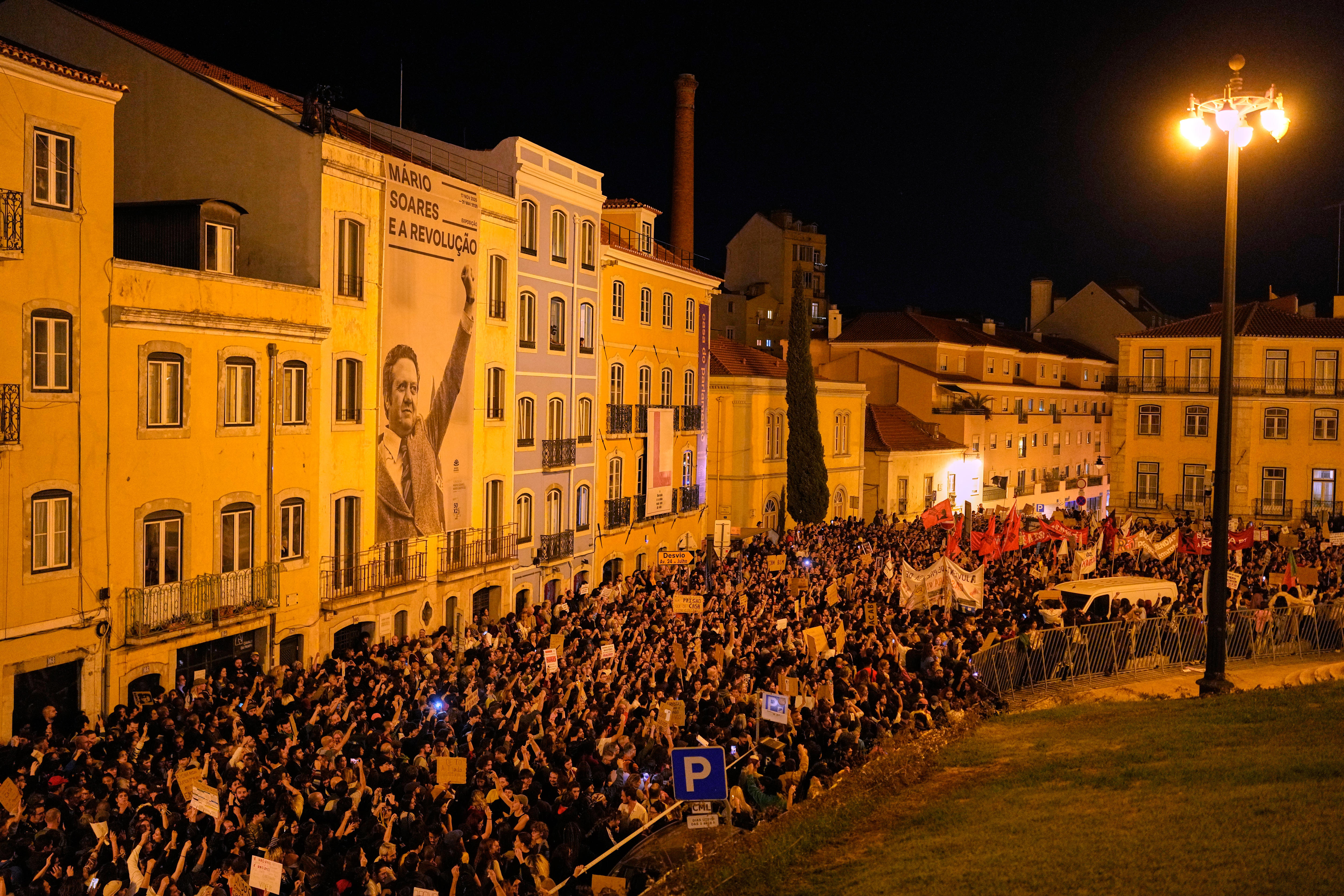 Protesters fill a street winding through Lisbon