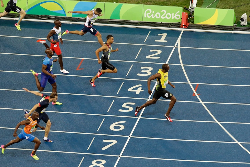 Usain Bolt crosses the line to win the 200m gold