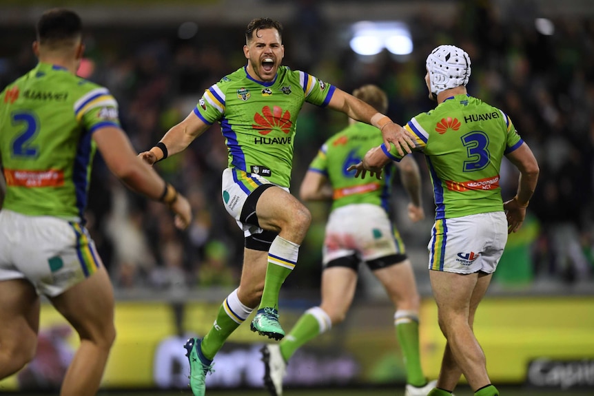 Canberra's Aidan Sezer (C) celebrates his winning field goal against Manly.