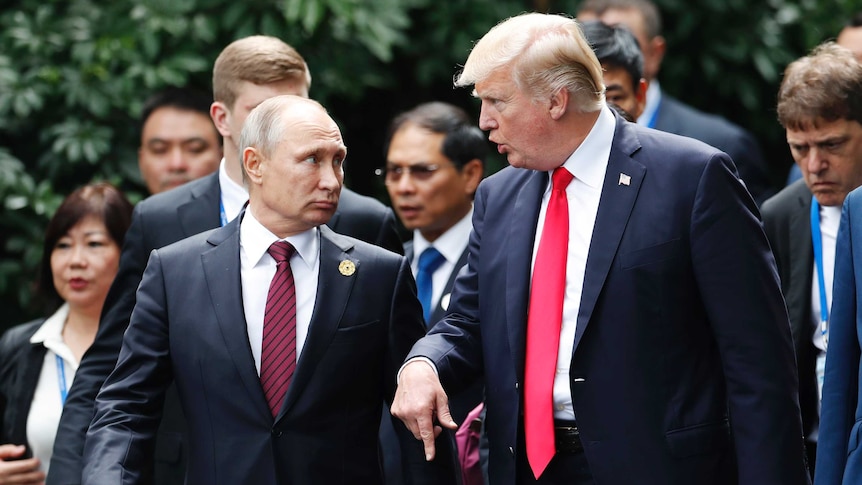 Vladimir Putin and Donald Trump speak at the APEC summit