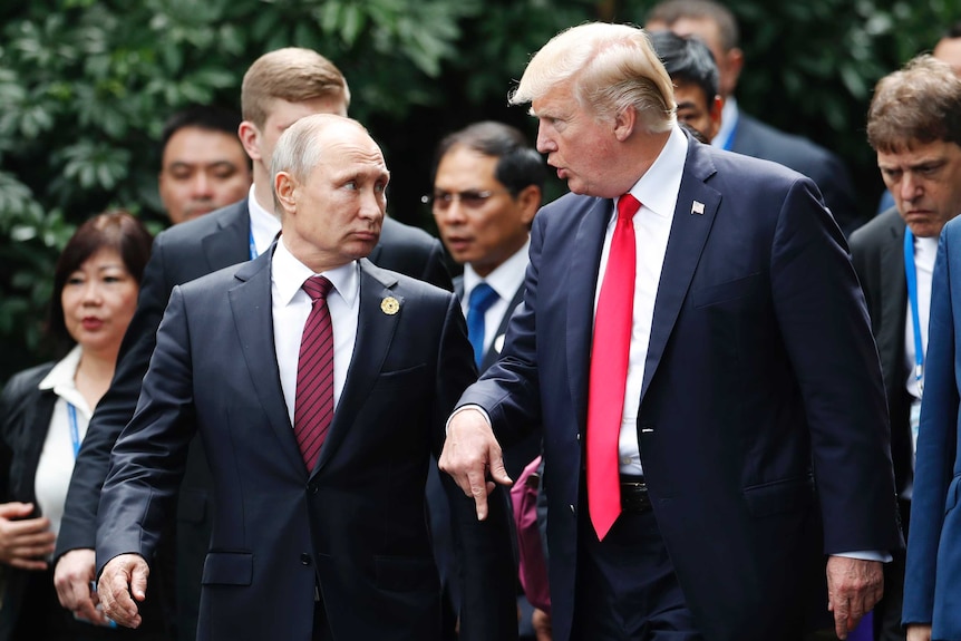 Vladimir Putin and Donald Trump speak at the APEC summit