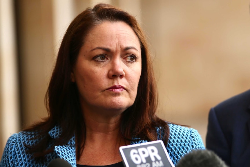 WA Opposition Leader Liza Harvey stares sternly as someone asks a question at a media conference