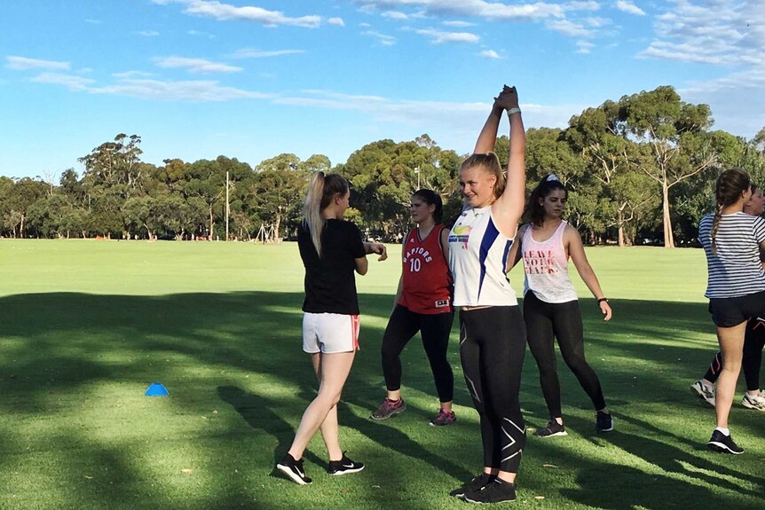 Women training for playing AFL
