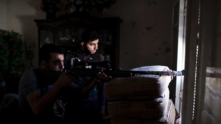 A sniper from the Shohada al Haq brigade of the Free Syrian Army